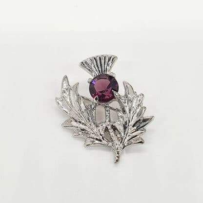 Brosche schottische Distel mit lila Stein